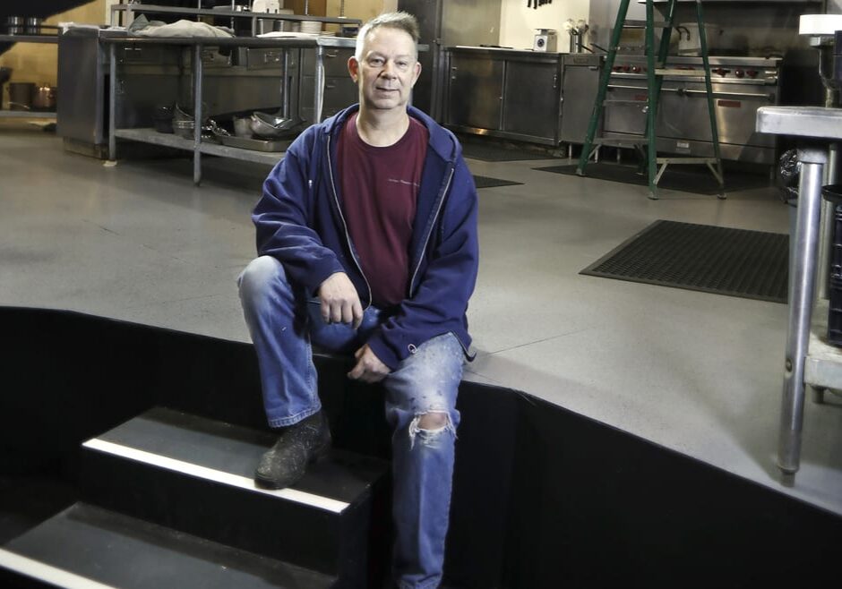 A scenic designer on stage