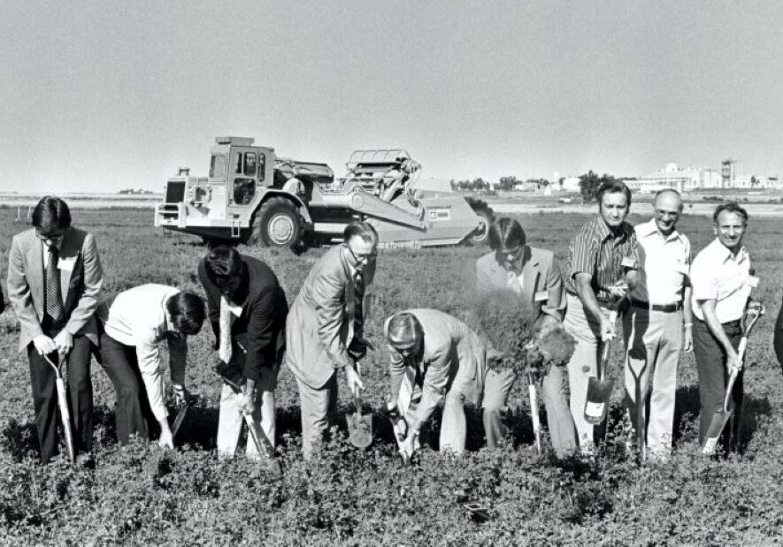 Local government officials and meatpacking executives shovel dirt at the groundbreaking of the meatpacking plant just outside Garden City in 1979.