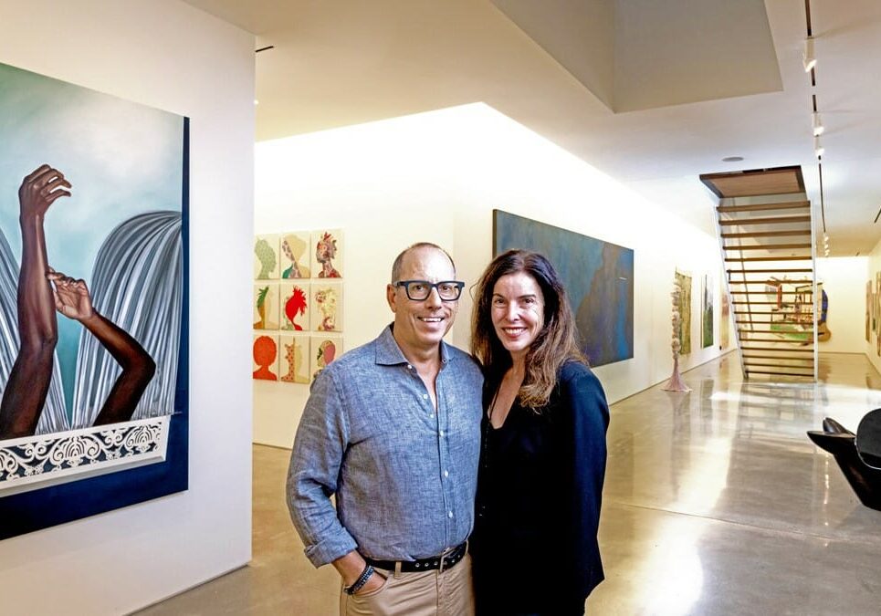 Bill and Christy Gautreaux with part of their collection inside their home.