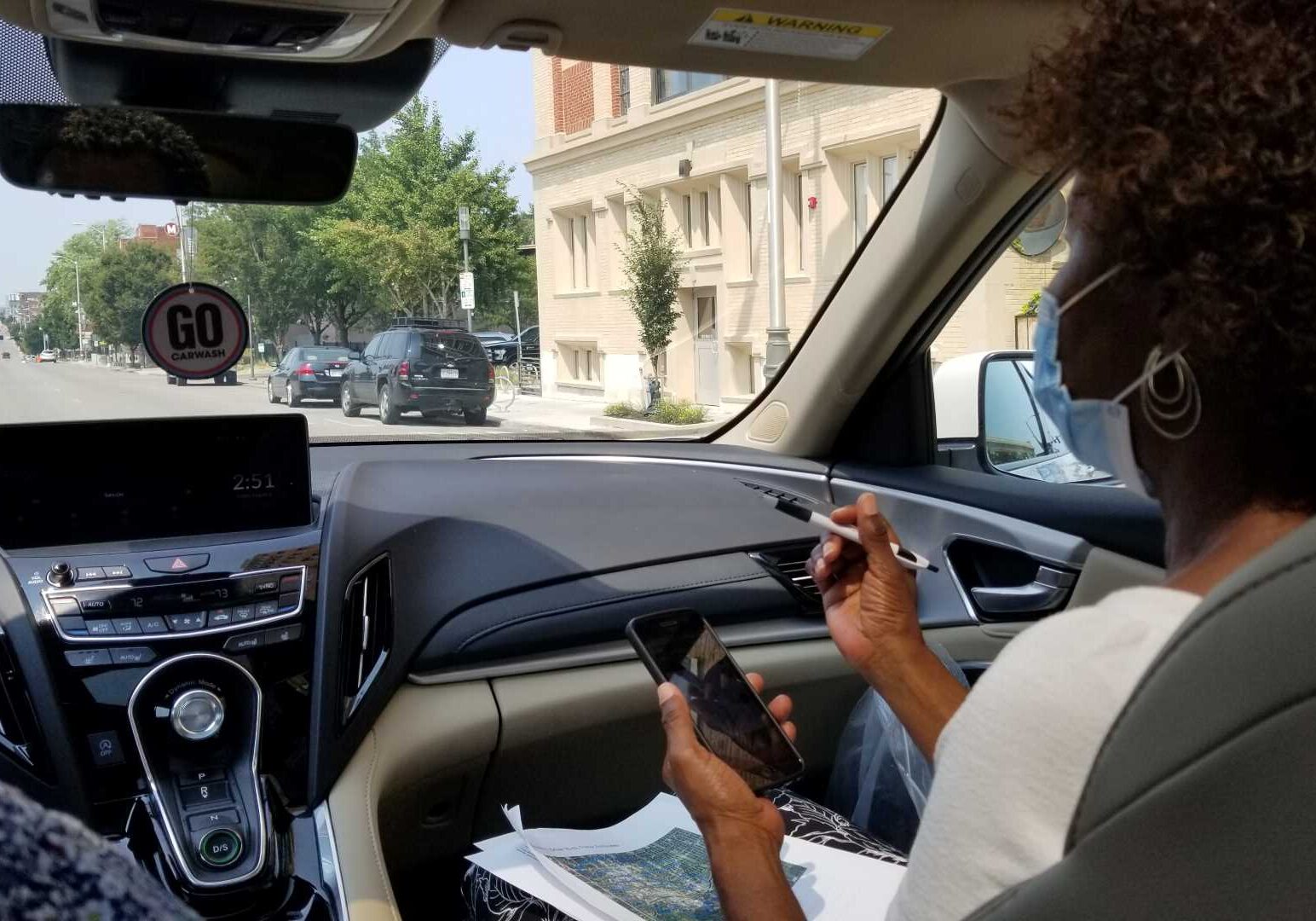 Brenette Wilder (right) navigates her husband, Cleotis, as he drives a route Aug. 6 collecting data for a heat-mapping project coordinated through the University of Missouri-Kansas City.