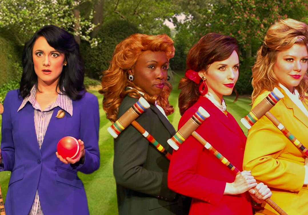 4 women playing croquet