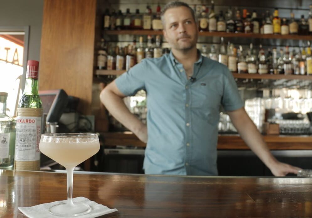 Julep's Beau Williams with the bar's Hemingway Daiquiri. (Photo: Cole Blaise | Flatland)