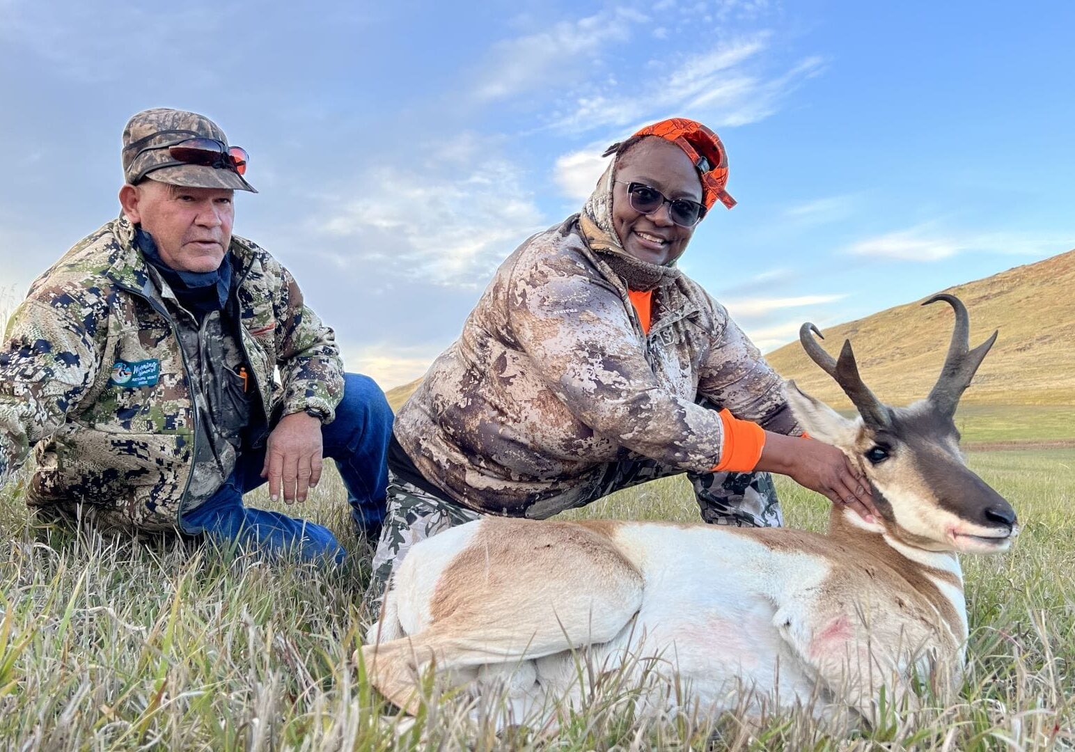 New hunter Antonette Coffee of Topeka posed with her guide, Mike Ellenwood, and the results of her first-ever hunting trip, an antelope buck.