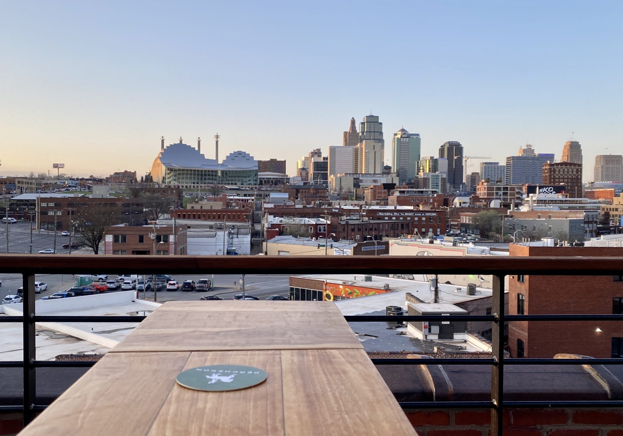 The north-facing view of the downtown skyline from Percheron on top of the Crossroads Hotel.