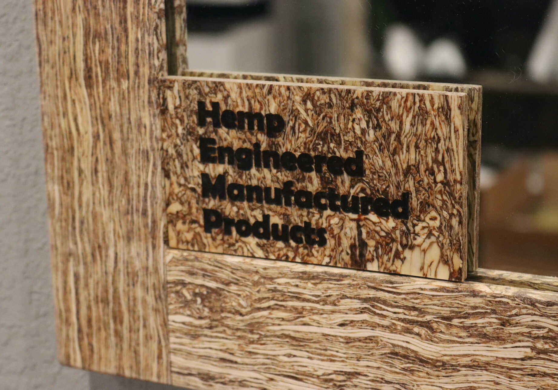 Sign on a mirror reads: hemp engineered manufactured products