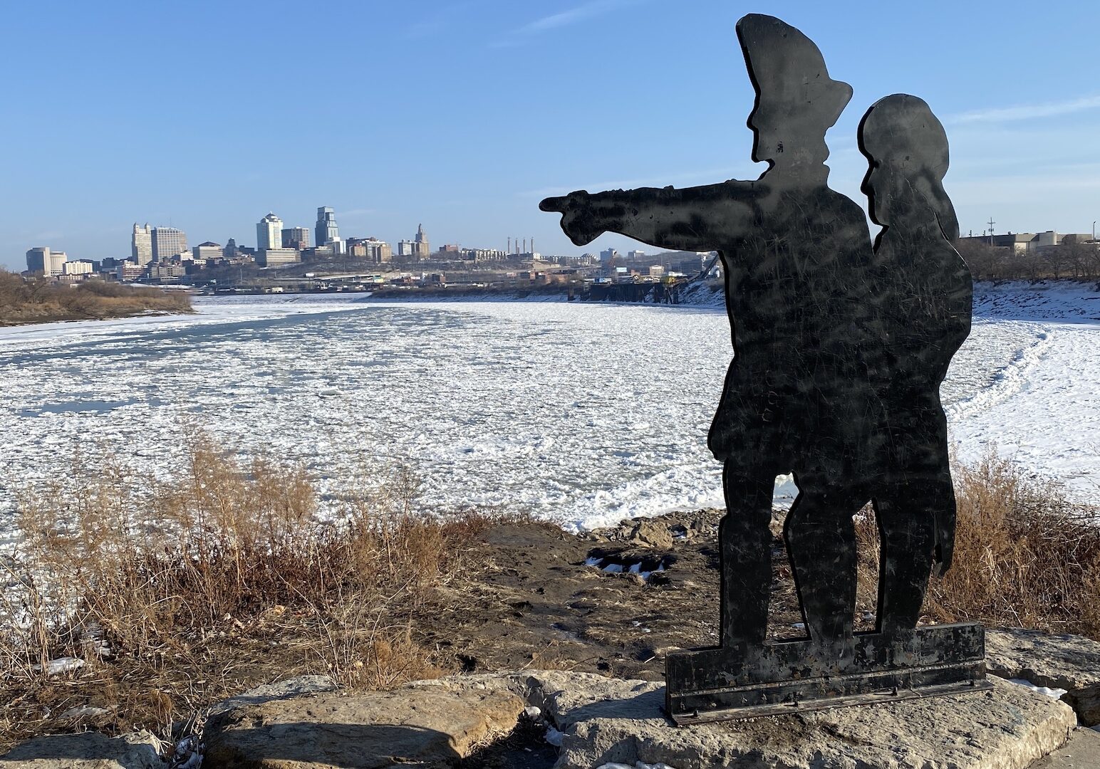 A Lewis and Clark statue pointing toward the KC skyline.