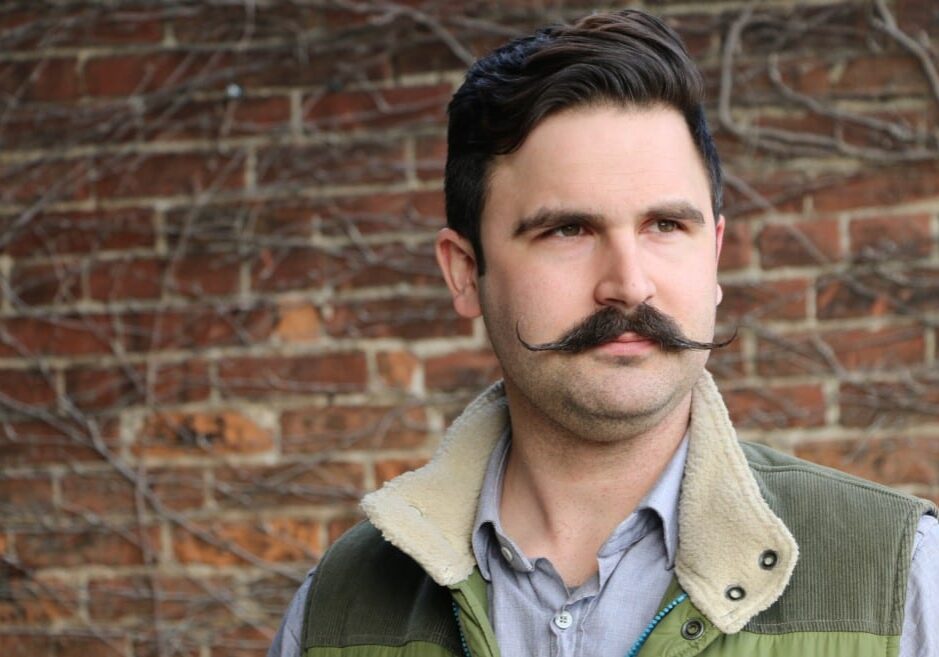 Bo Nelson, co-founder of Thou Mayest, stands outside of this soon to open coffeehouse on 18th street.