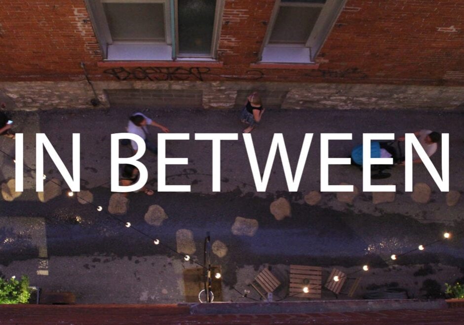 Image of an alley with words In Between written on it