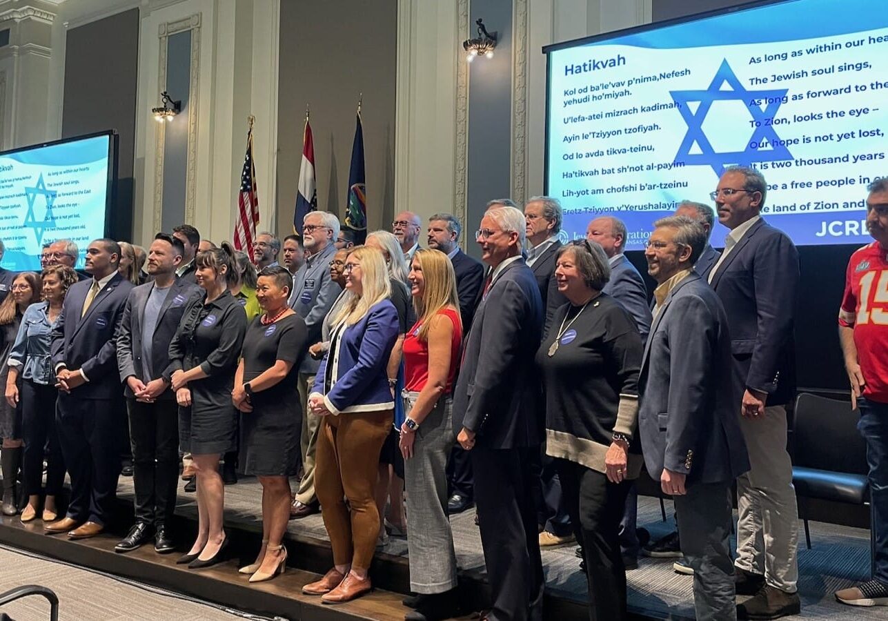 Local elected and civic officials stood for photos at the conclusion of an update on Israel held in the boardroom of the Greater Kansas City Chamber of Commerce.