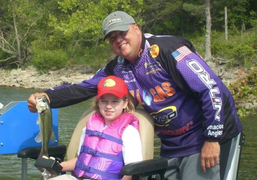 J.P. Sell was all smiles after helping Courtney, who has cerebral palsy, catch her first fish.
