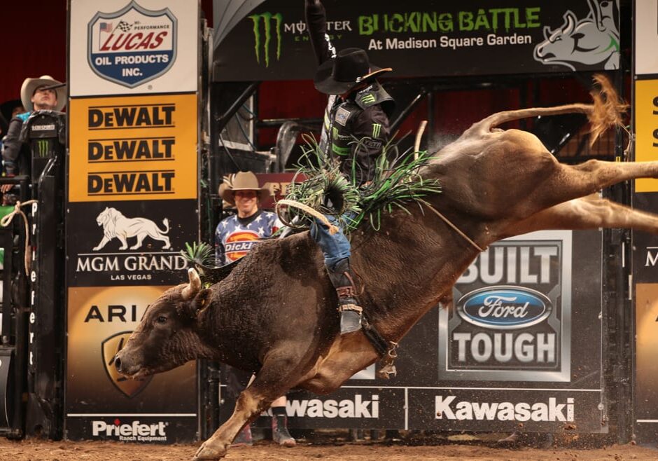JB Mauney rides Cornwell Bucking Bulls's Blue Hurricane for 85 during the first round of the New York City Built Ford Tough series PBR. Photo by Andy Watson
