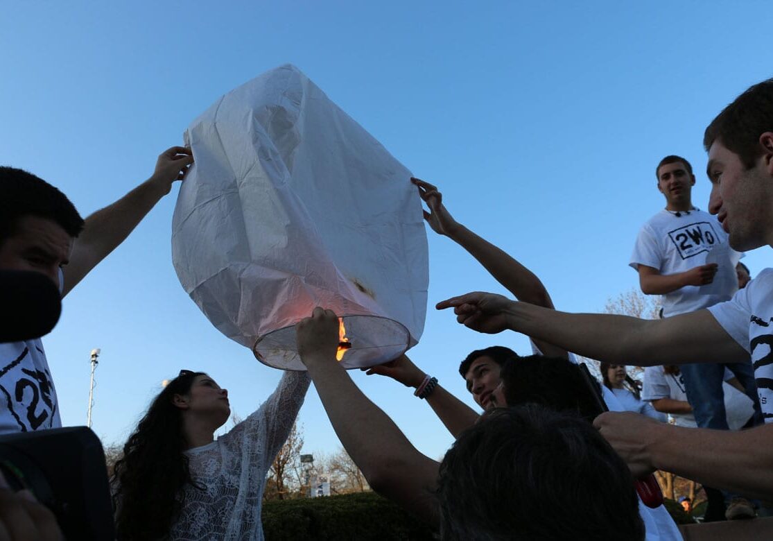 Teens try to launch a lantern