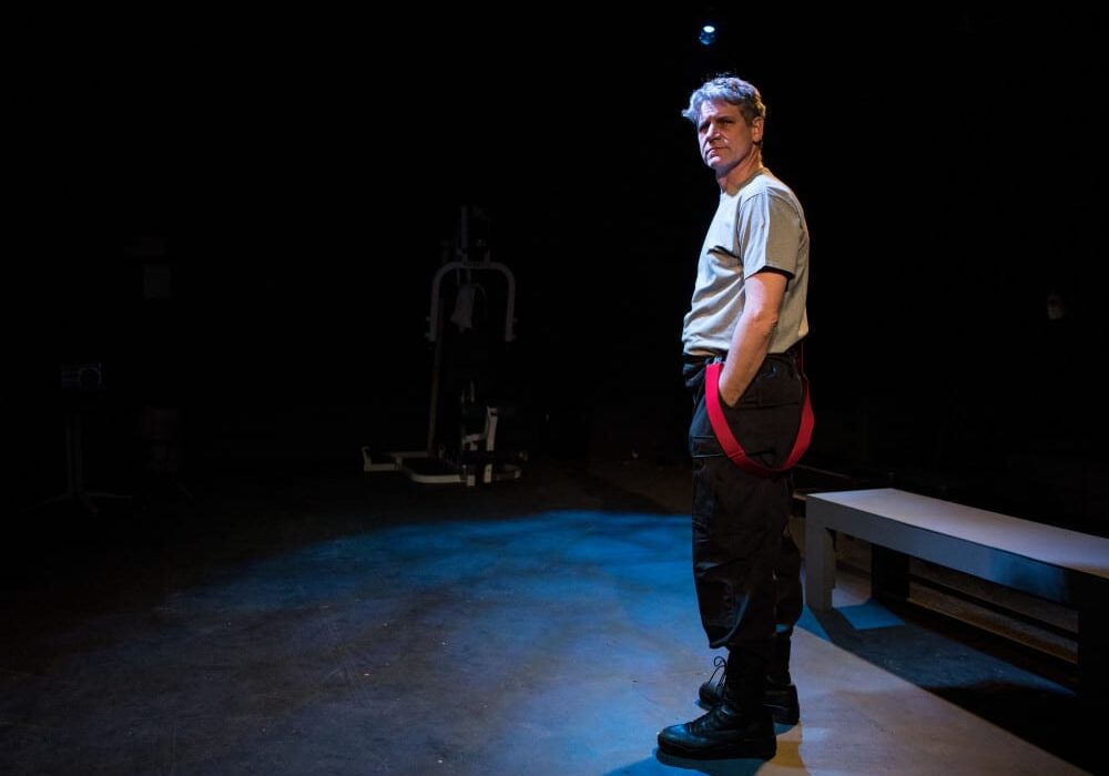 Actor Tim Ahlenius spoke from the perspective of working firefighters, in the production of Justice in the Embers, Feb. 4-20, 2016. (Photo: Brian Paulette | The Living Room Theatre)