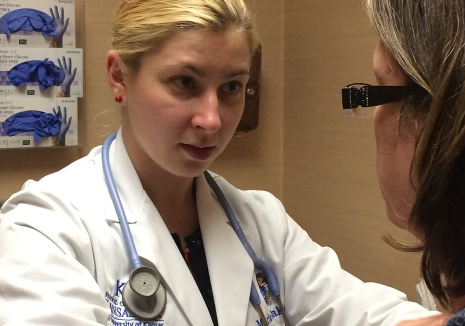 KU Med student Maria Iliakova examines a patient at the free JayDoc clinic in Kansas City, Kansas.