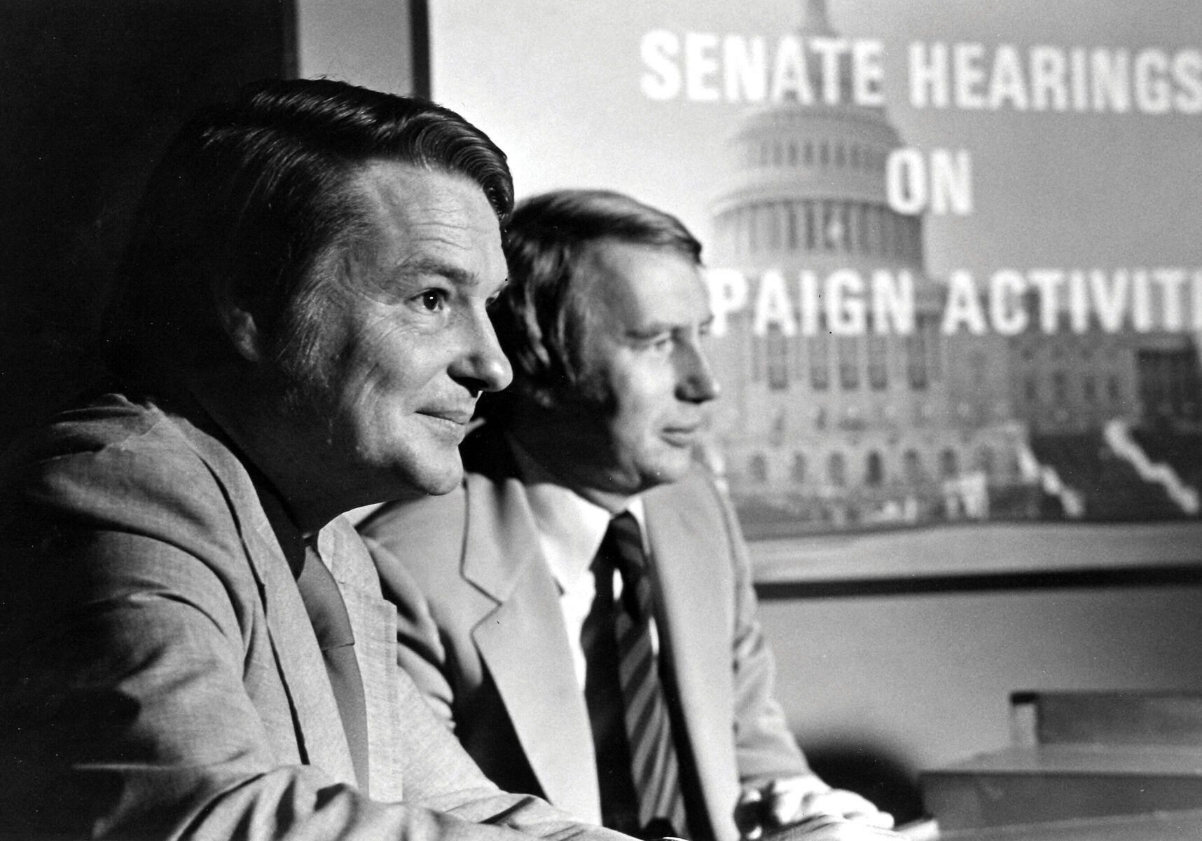 This 1973 image released by PBS shows co-anchors Jim Lehrer, left, and Robert MacNeil reporting on the Watergate hearings. PBS announced that Lehrer died Thursday, Jan. 23, 2020, at home. He was 85. (PBS via AP)