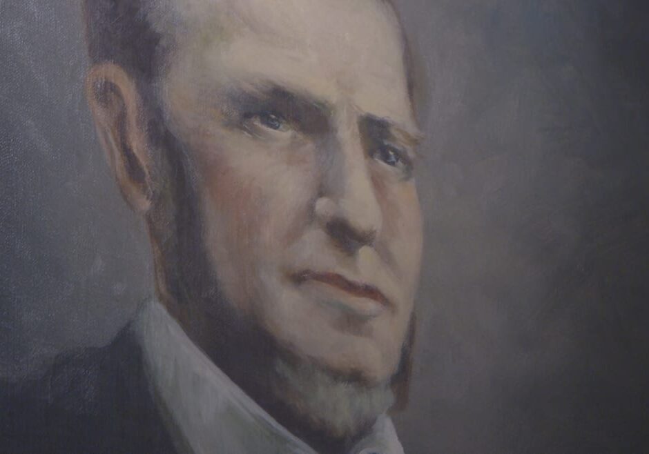 Close up picture of 1800s portrait of a man.