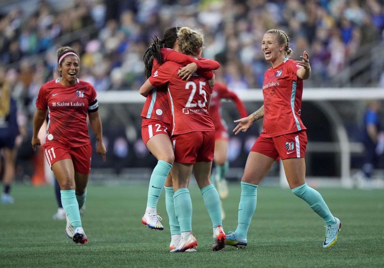 Kansas City Current players celebrate a goal.