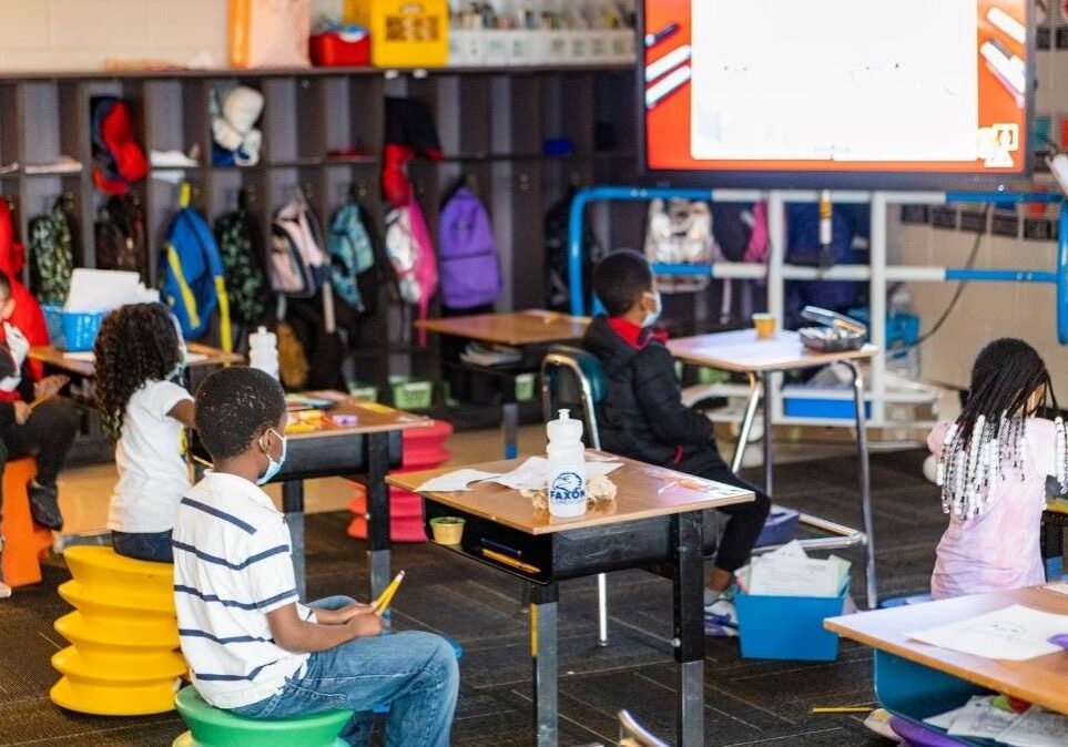 Members of a second grade class sit in their chairs at Faxon Elementary School in Kansas City.