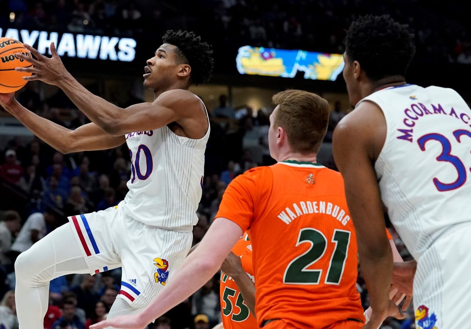 Kansas' Ochai Agbaji shoots during the second half of a college basketball game in the Elite 8 round of the NCAA tournament Sunday, March 27, 2022, in Chicago.