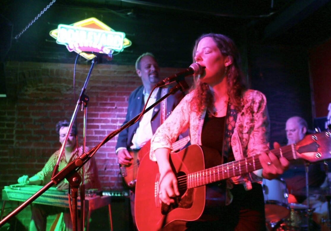 Musician Kasey Rausch plays with The Naughty Pines at Westport Saloon. (photo by John McGrath/Hale Center for Journalism)