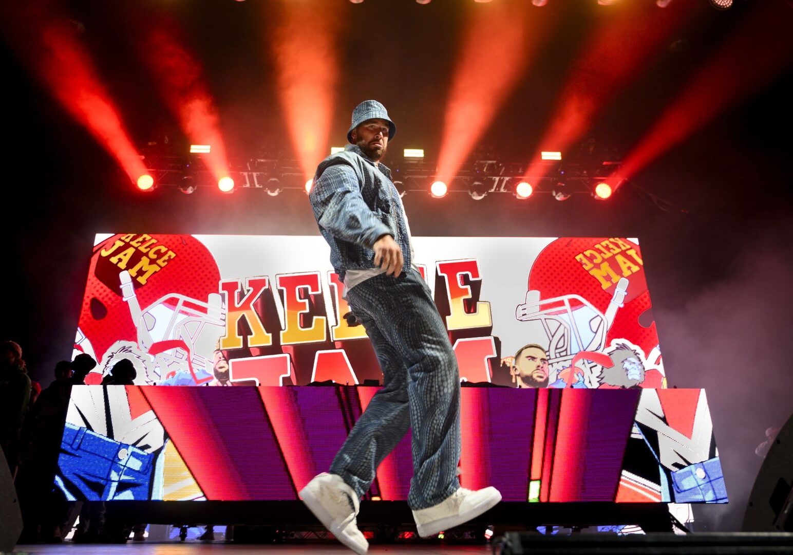 Travis Kelce, Kansas City Chiefs tight end and host of Kelce Jam, dances across the stage during the music festival on Friday, April 28, 2023, in Bonner Springs, Kansas.