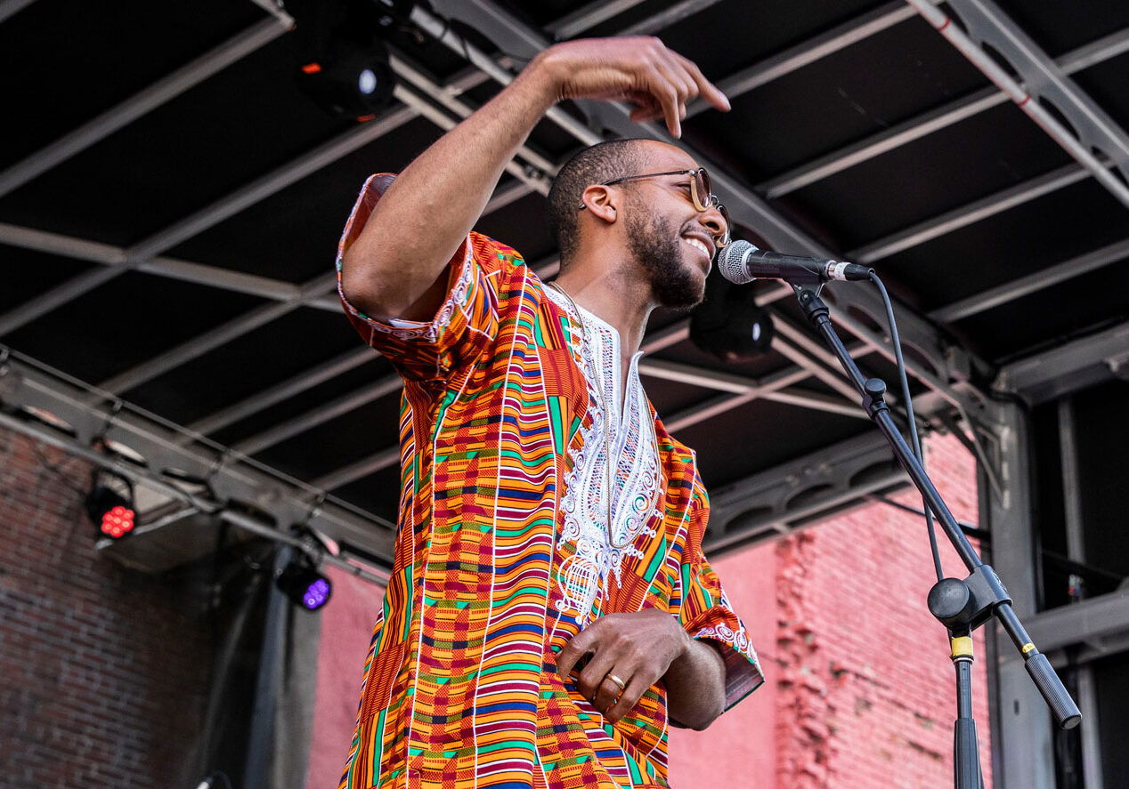 Kemet Coleman performs a song.
