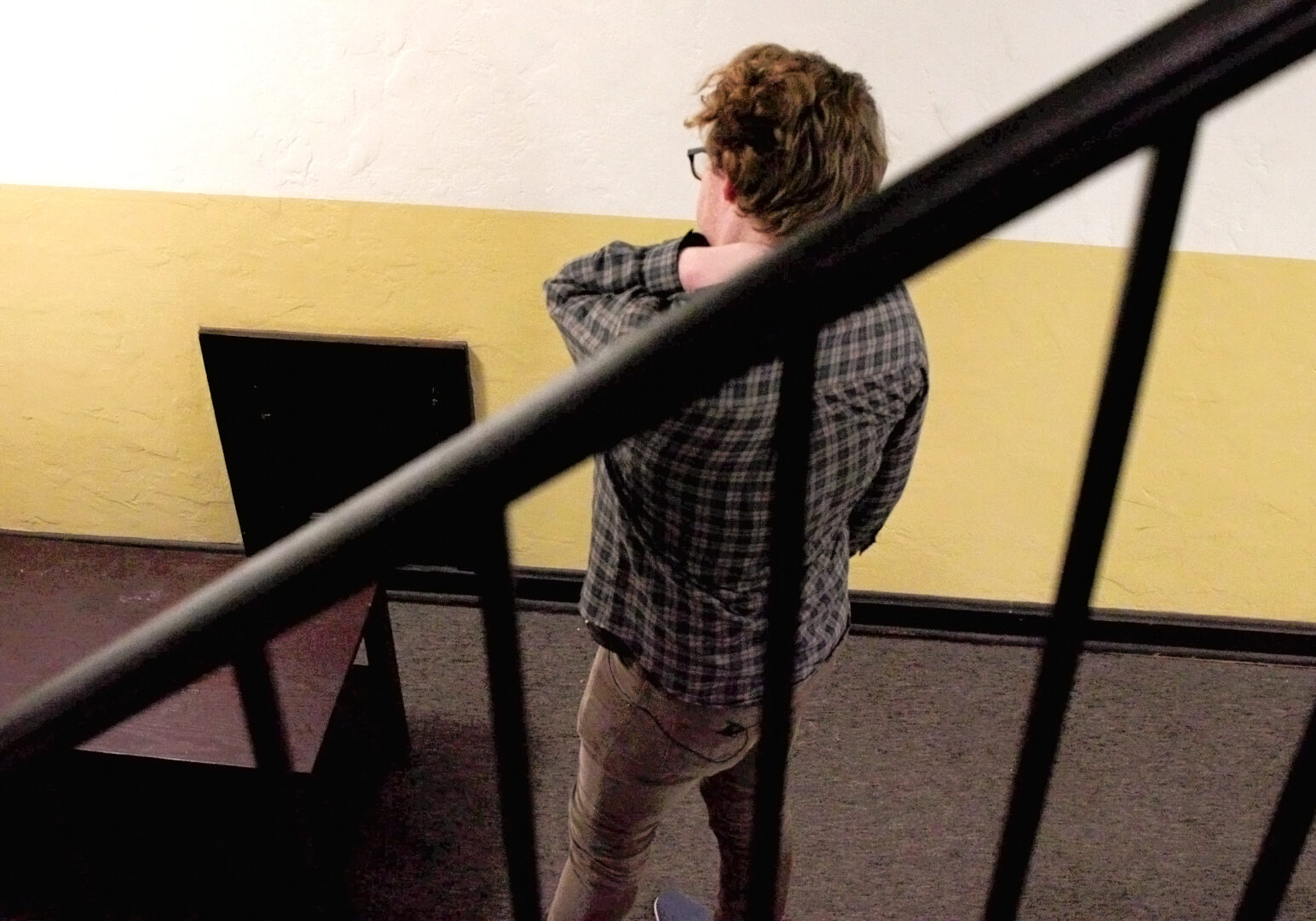 Kieran Vickers catches a breath after moving his furniture out of The Alps Apartments.