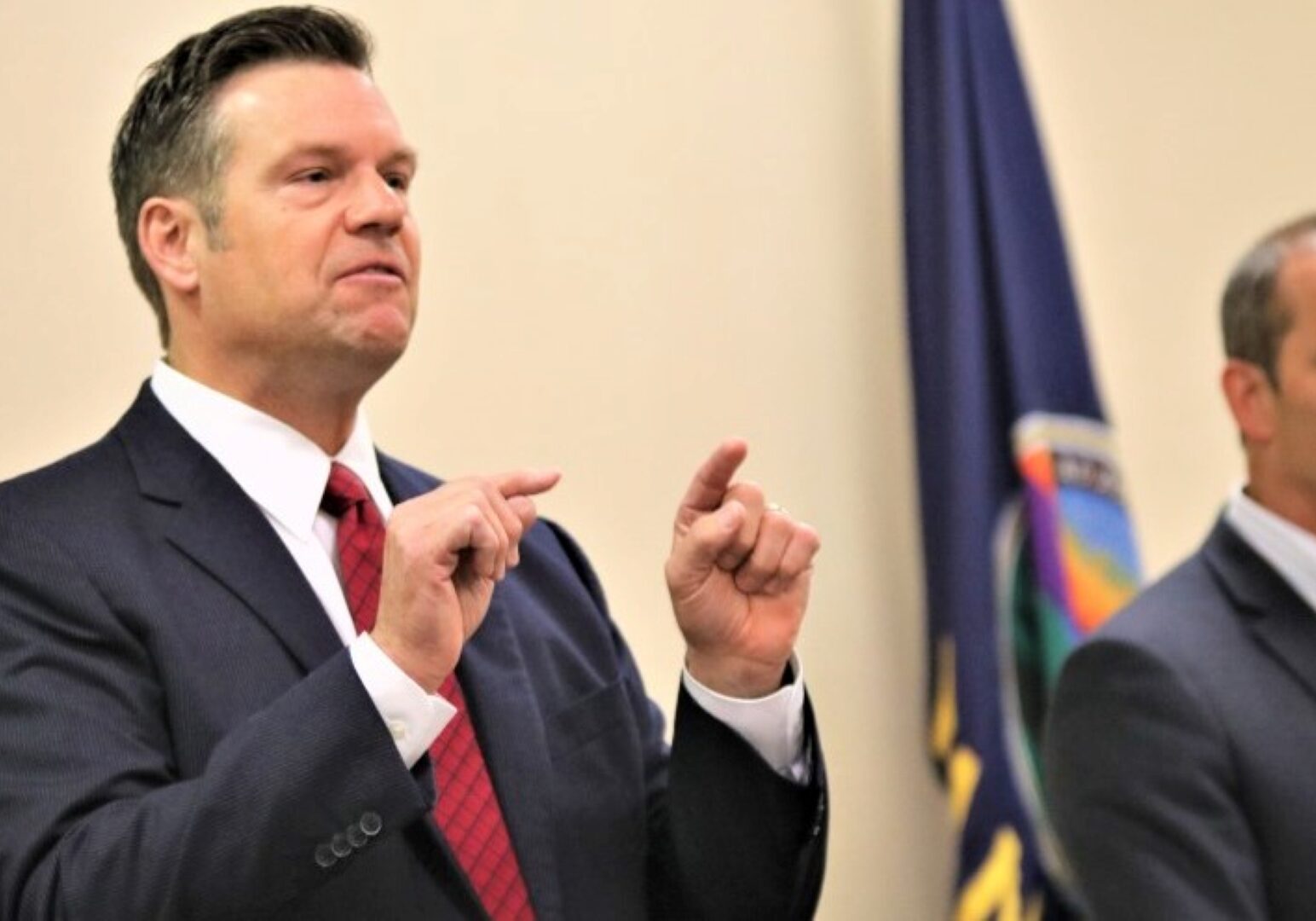 Kris Kobach and Bob Hamilton at a debate