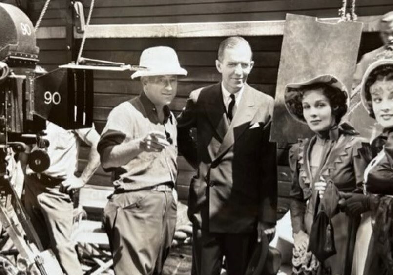 Landon Laird on the set of “The Buccaneer” with Cecil B. DeMille and, on right, Louise Campbell and Margot Grahame in 1937.