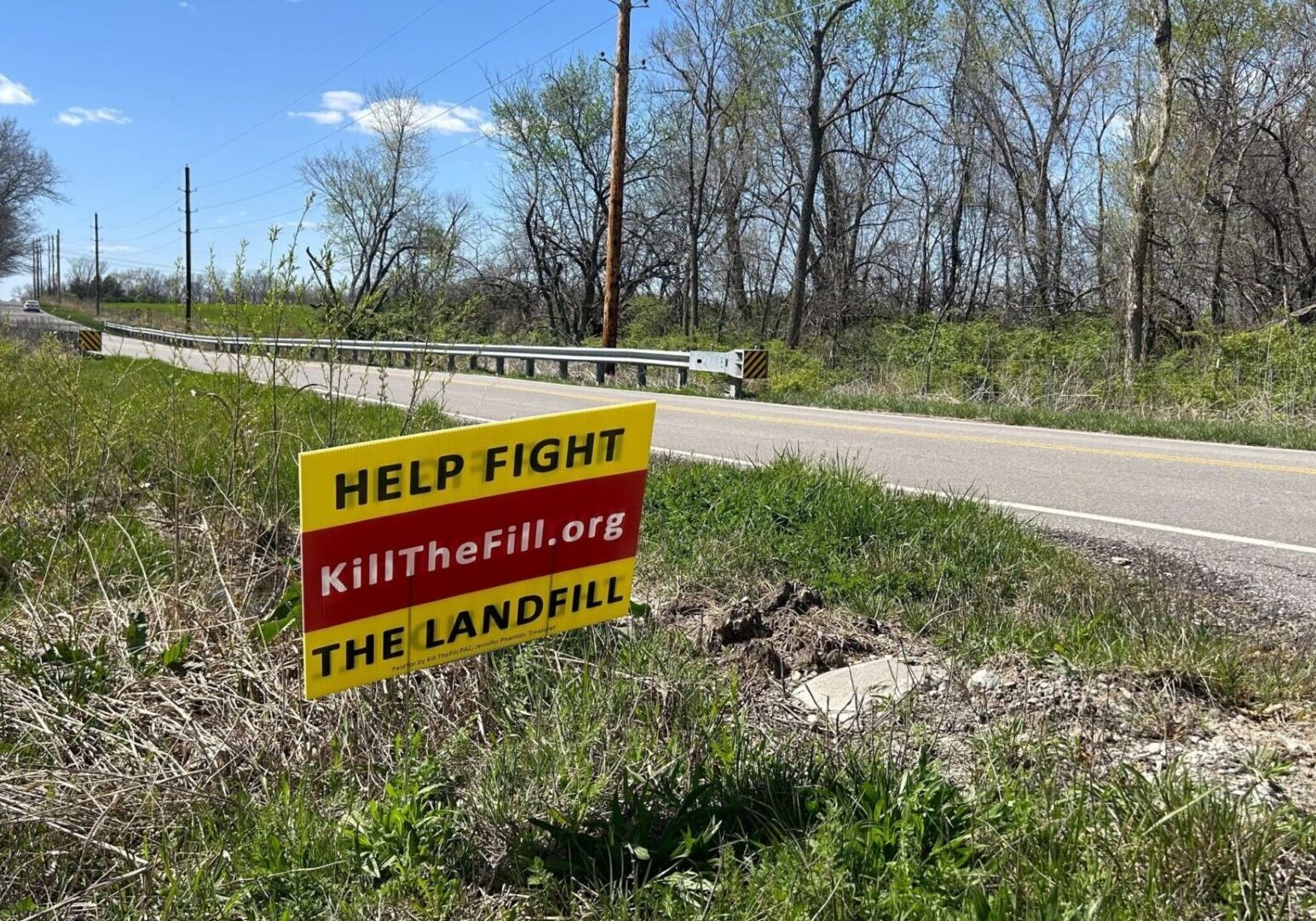 A sign across from the proposed landfill in south Kansas City implores drivers to help stop the project from moving forward.