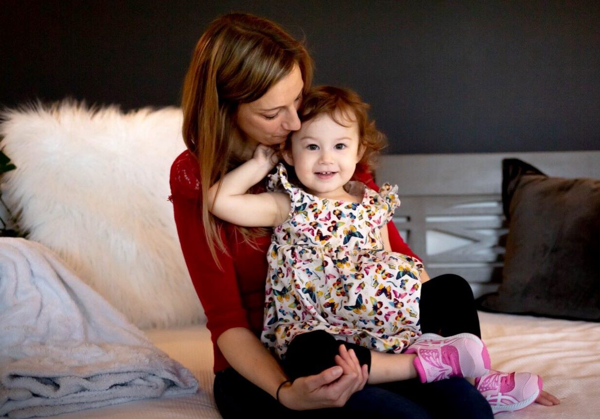 Lisa Pascoe with her 2-year-old daughter on March 23, 2022, at their home Clarkson Valley, Mo.