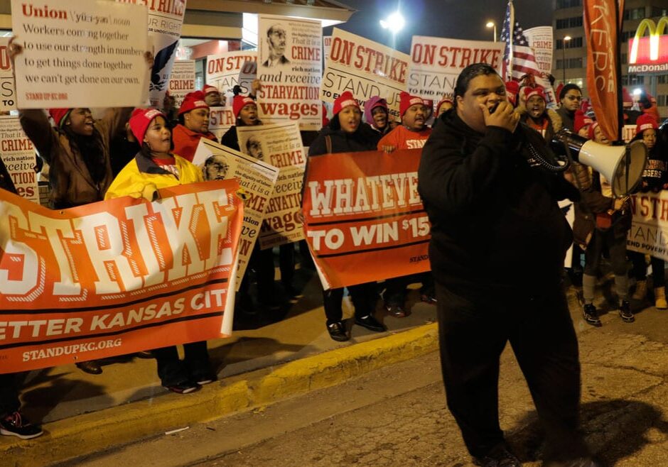 Andrew McConnell rallies his fellow fast food workers during a pre-sunrise strike Thursday morning. (photo by Caitlin Cress/Hale Center for Journalism)