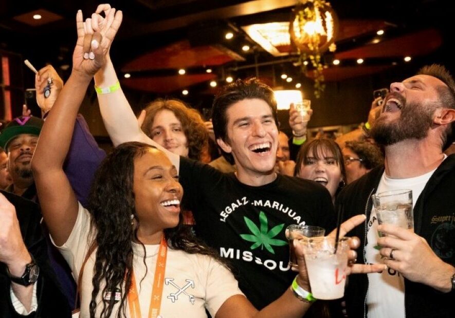 From left: Tanisha Patterson, Ryan Quinones and Chris LeGrand celebrate the passage of Amendment 3 on Tuesday during a watch party at the Crown Room in downtown St. Louis.