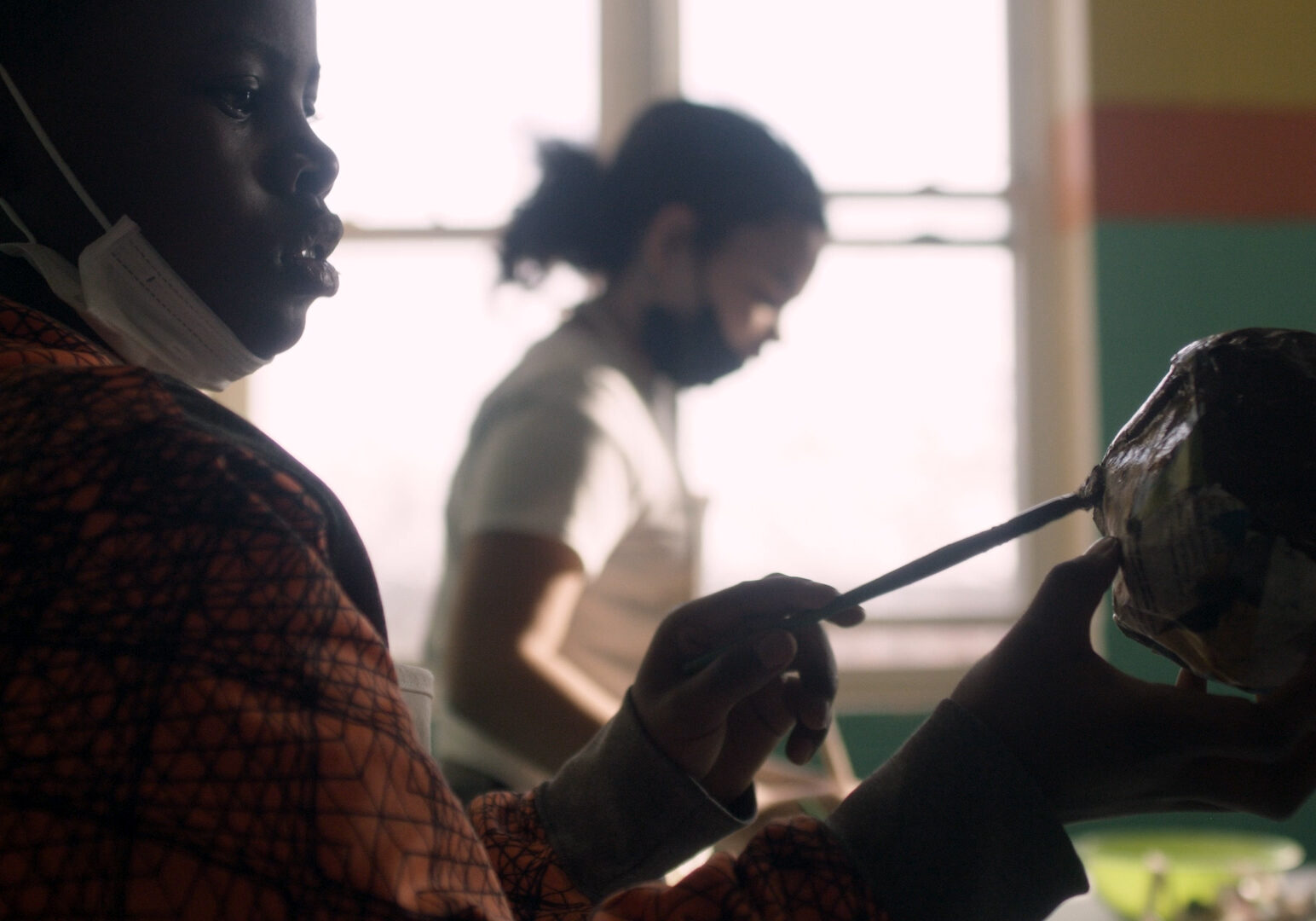 Young people painting at the Mattie Rhodes Center.