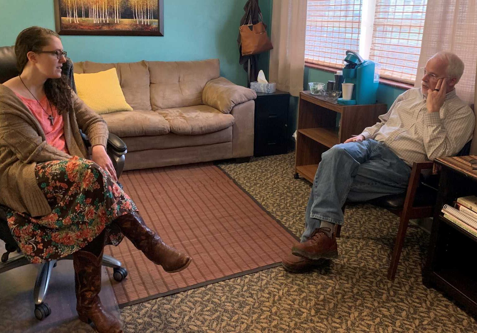 Amy Taft and Dr. John Hudson talk in their office located in the basement of the First Christian Church of Cameron, Missouri.