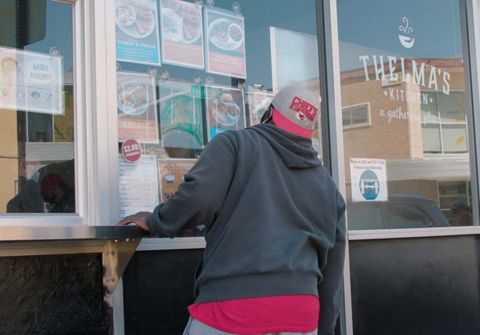 A customer selects food at Thelma's Kitchen.