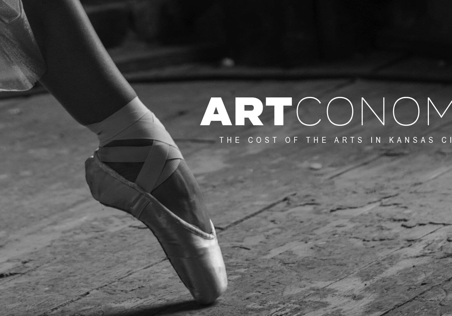 A ballerina's foot and the words Artconomy