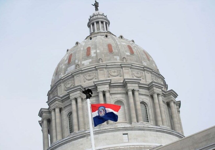 The Missouri state flag is seen flying outside the Missouri State Capitol Building on Jan. 17, 2021, in Jefferson City.