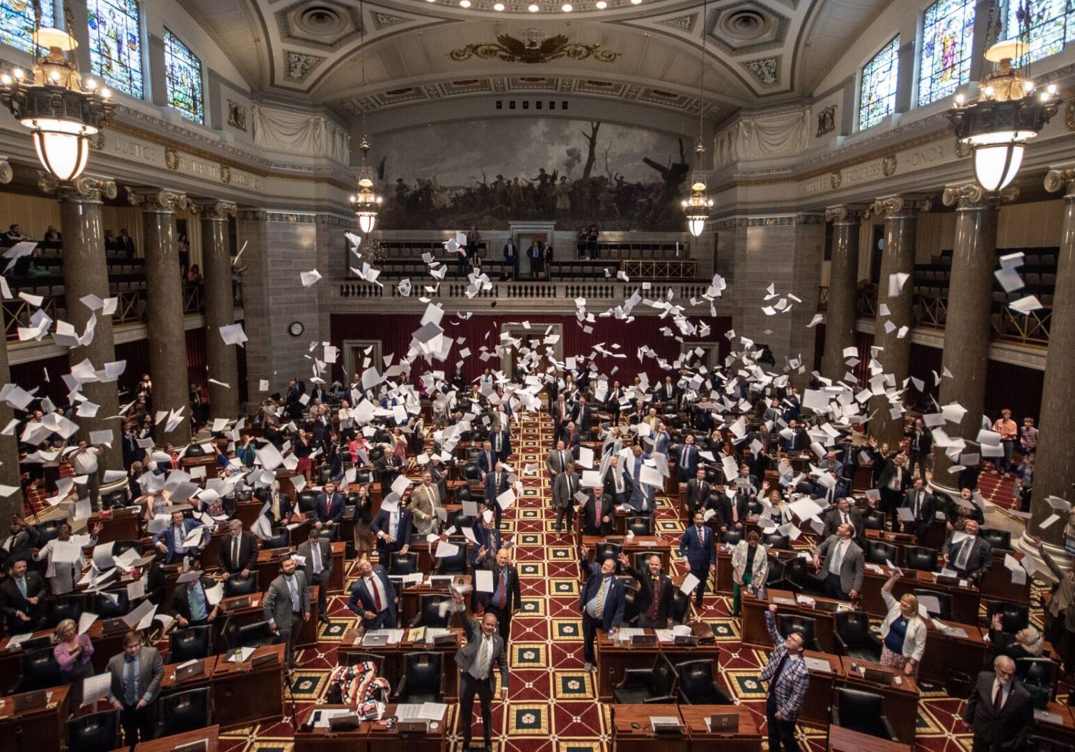 The Missouri House of Representatives commemorates the end of the 2024 legislative session by tossing hard copies of bills into the air upon adjournment.