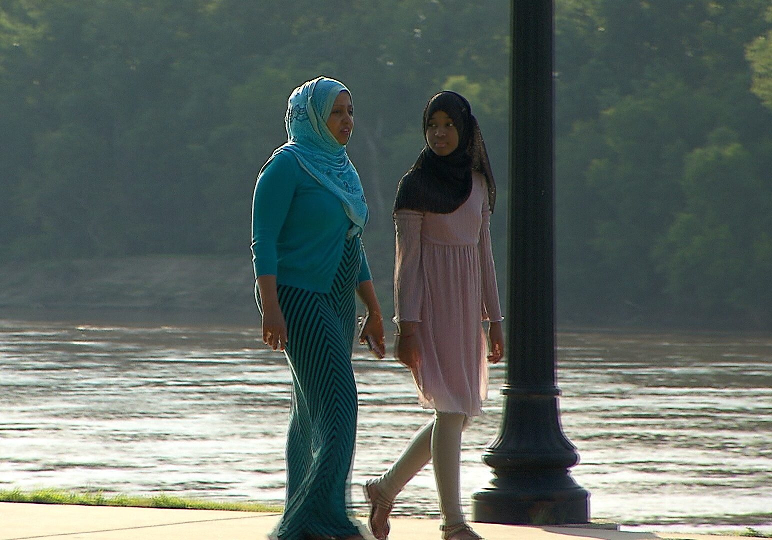The journey of Muni Abdi (left) began in war-torn Somalia and ended in Kansas City.