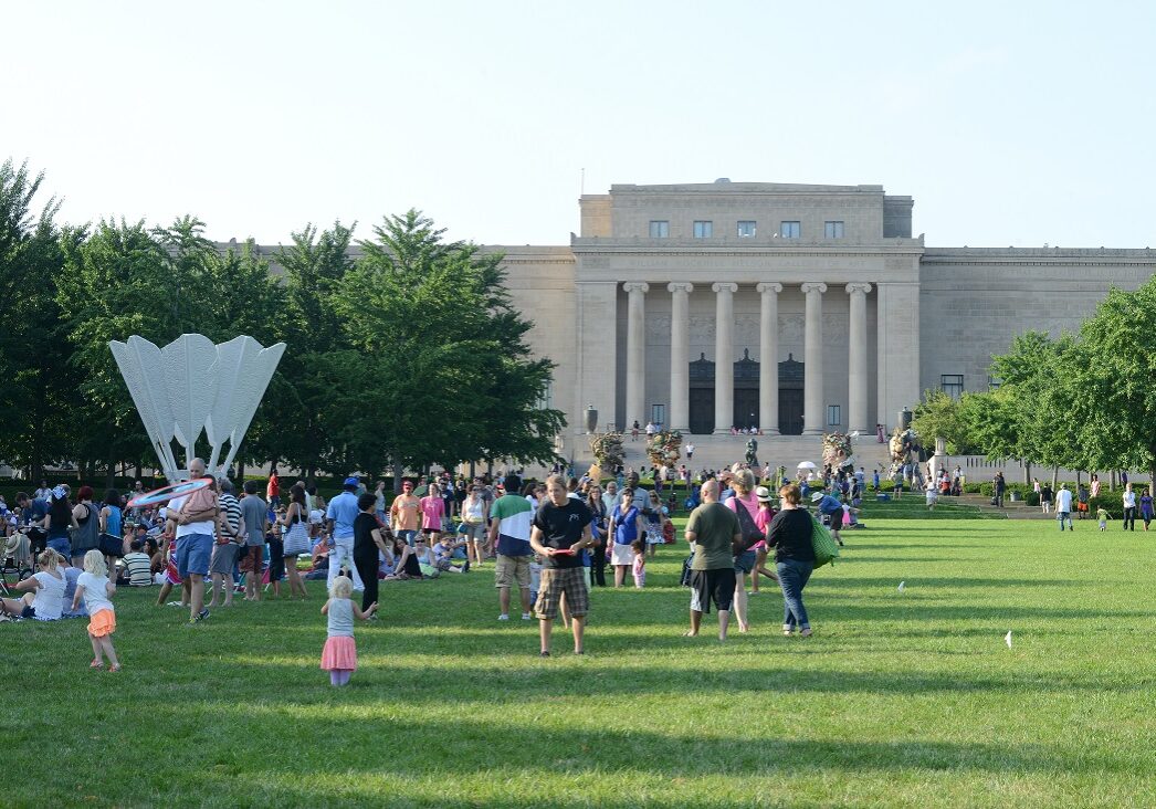 Families enjoying the afternoon on the museum's lawn.