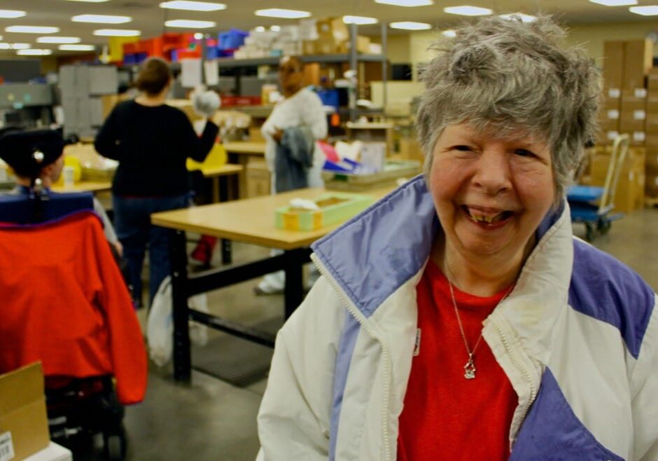 Nancy Swogar is one of about 230 people served by Johnson County Developmental Supports. Gov. Sam Brownback went to the facility on Friday to announce he will ask the Legislature to spend another $2.6 million in state funds to help reduce the waiting lists for services for the disabled. (Photo by Mike Shields/KHI News Service)