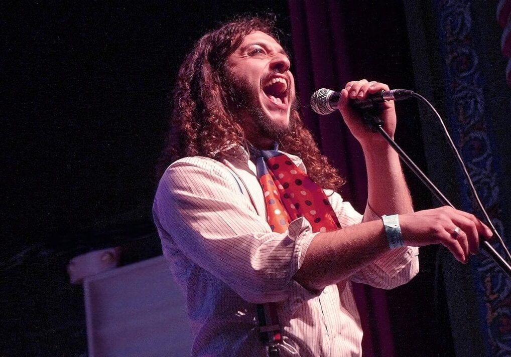 A man singing into a microphone.