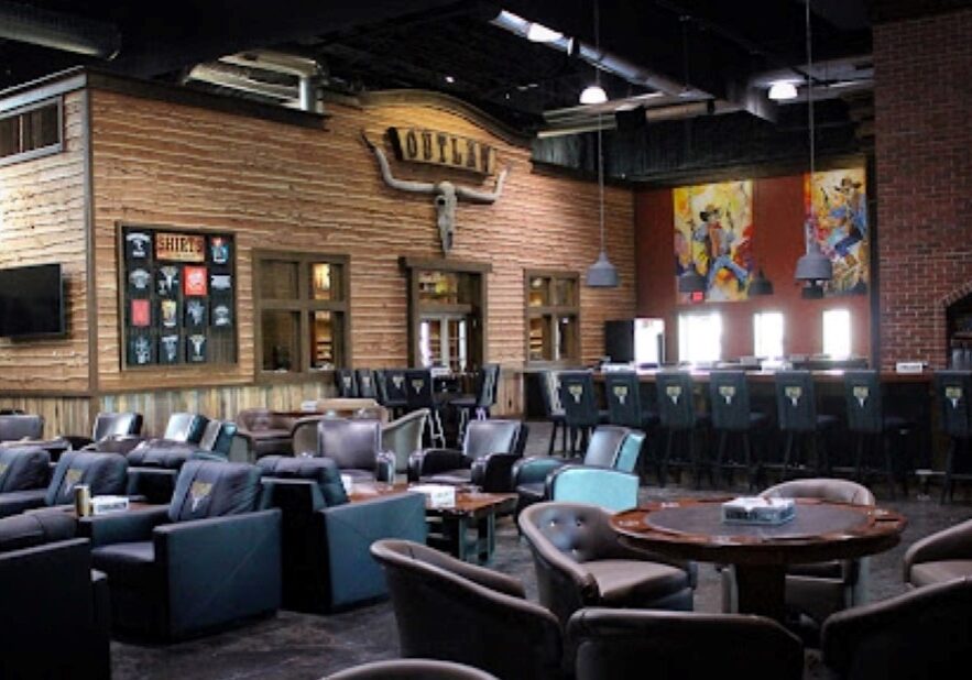 Interior view of seating and poker tables at Outlaw Cigar & Brewery.