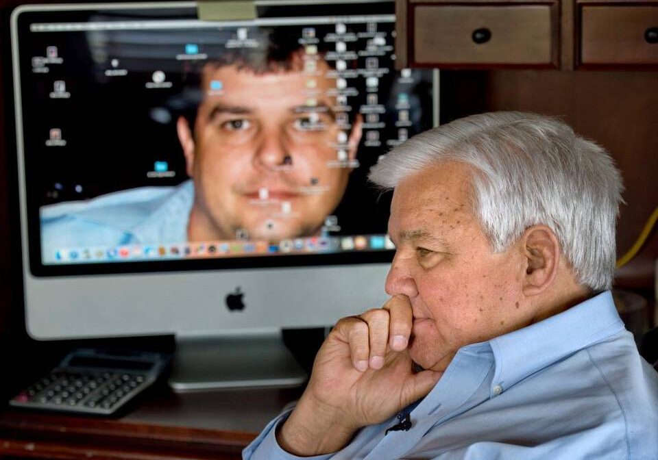 A picture of Bob Paudert’s son Sgt. Brandon Paudert is the background on the former police chief’s computer. Bob Paudert continues to relive the day of his son’s violent death, hoping his work will prevent more tragedies. (Photo by: Keith Myers/The Kansas City Star)
