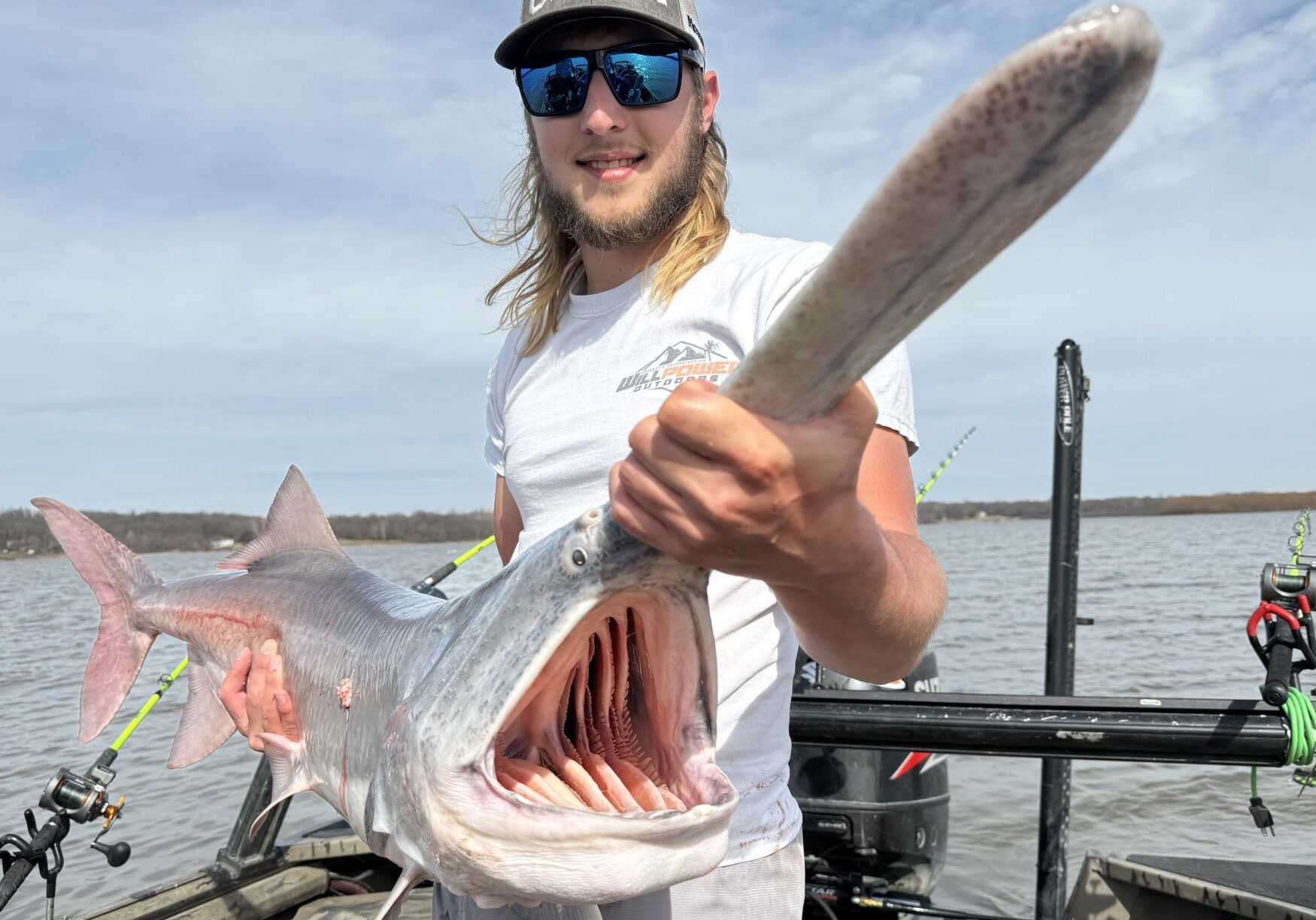 Haydn Williams, a guide on Grand Lake O' the Cherokees, displays the carrier of spring fever – a paddlefish.