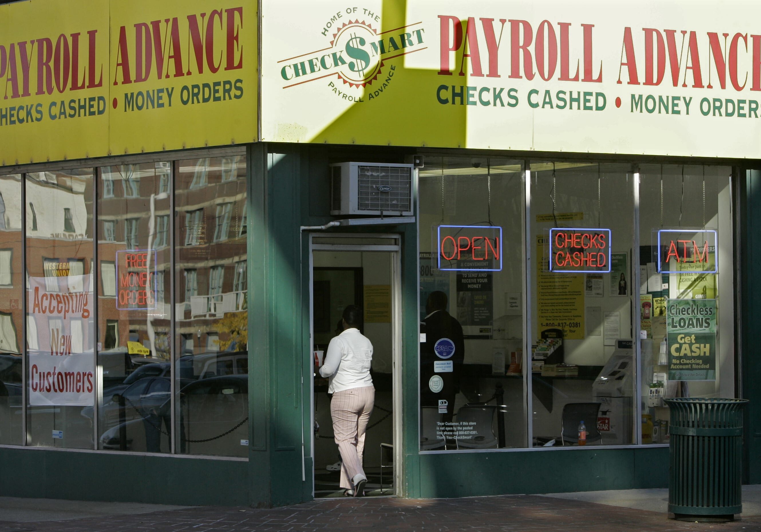 A customer enters a Payroll Advance location, Thursday, Nov. 6, 2008, in Cincinnati, Ohio. Voters approved an issue that upholds a state law that caps interest rates and limits the number of loans a person can make in one year. The payday loan industry - stung at the Ohio ballot box with a strict new law - is looking for other ways to do business, prompting consumer advocates to worry that lenders are finding a way around the election results. (AP Photo/Al Behrman)
