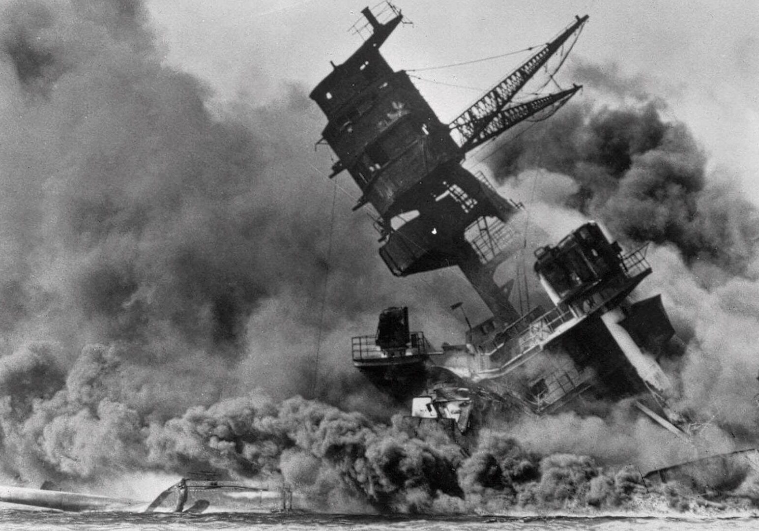In this Dec. 7, 1941, file photo, smoke rises from the battleship USS Arizona as it sinks during a Japanese surprise attack on Pearl Harbor, Hawaii.