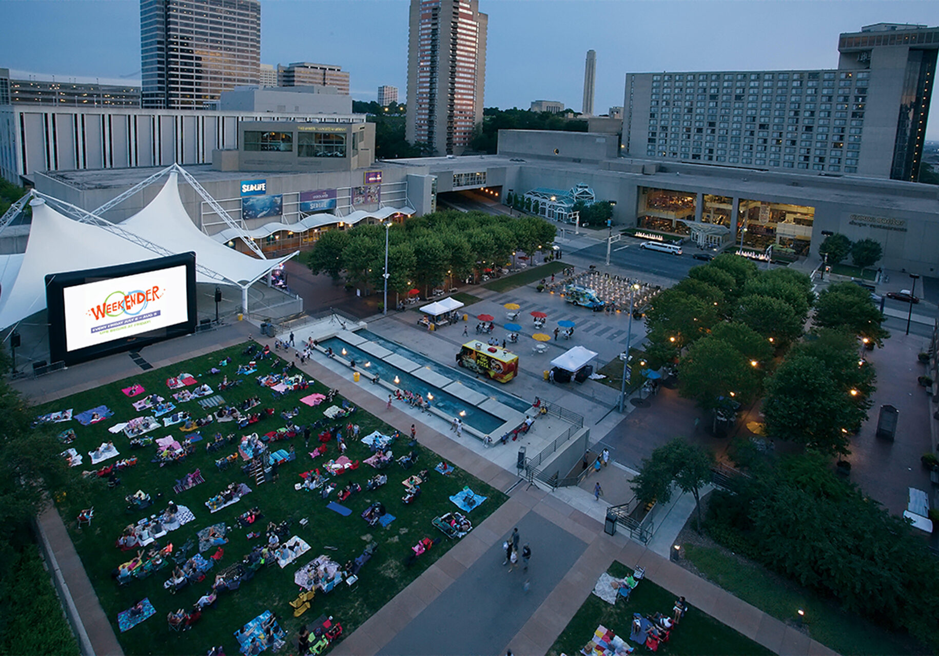 Families gather at Crown Center's WeekEnder Series to watch a show.
