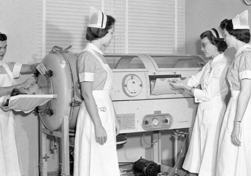 Nurses at the University of Kansas Medical Center demonstrated the use of a tank respirator, or “iron lung,” for polio patients in 1950.